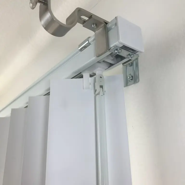 close-up-of-white-aluminum-curtain-track-mounted-to-ceiling-with-metal-bracket